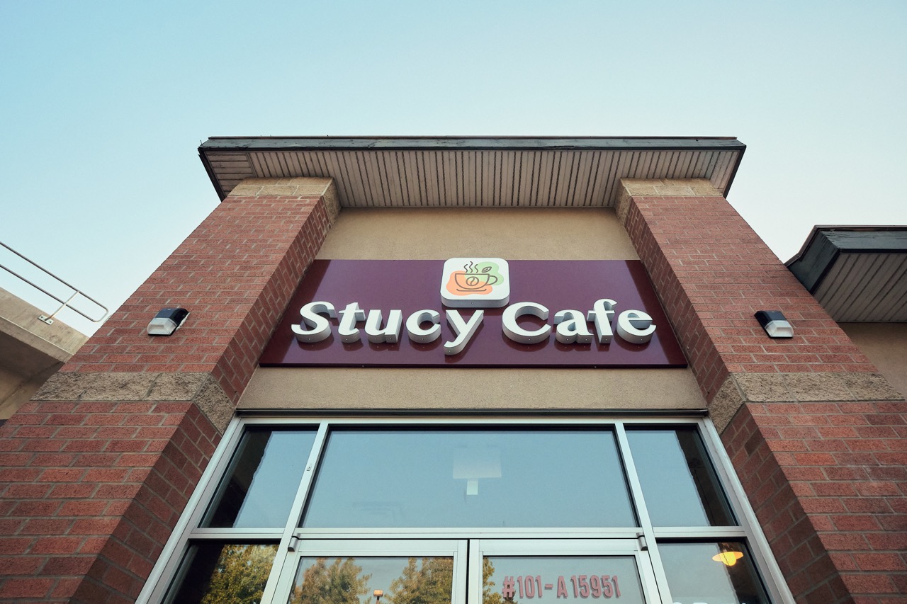 The Stucy Cafe sign above the entrance on Fraser Hwy.